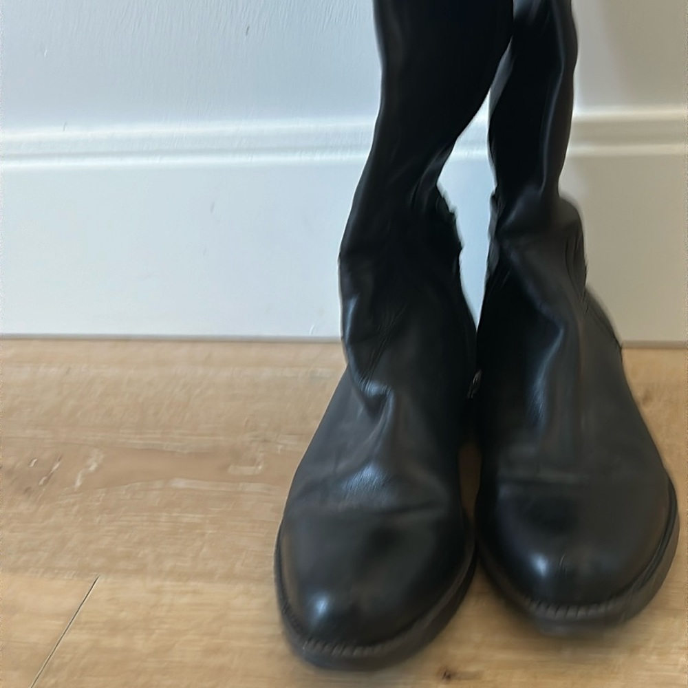 Black tall boot